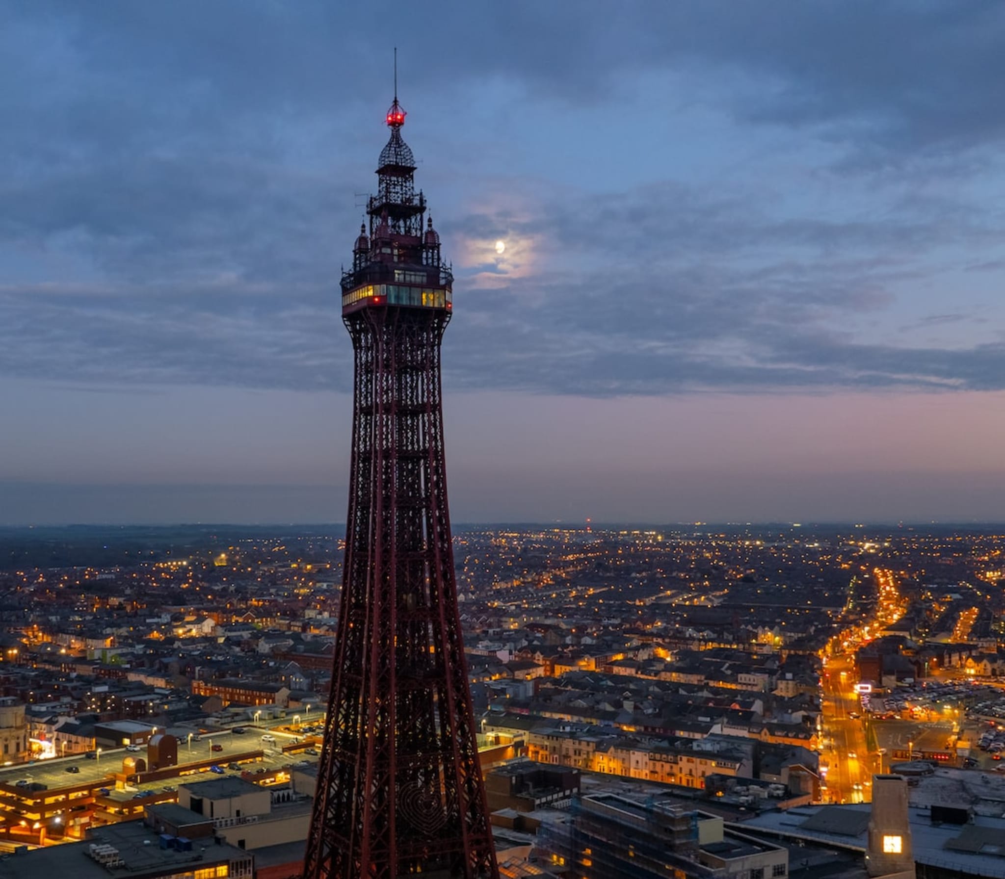 Blackpool Tower at dusk above the town lights