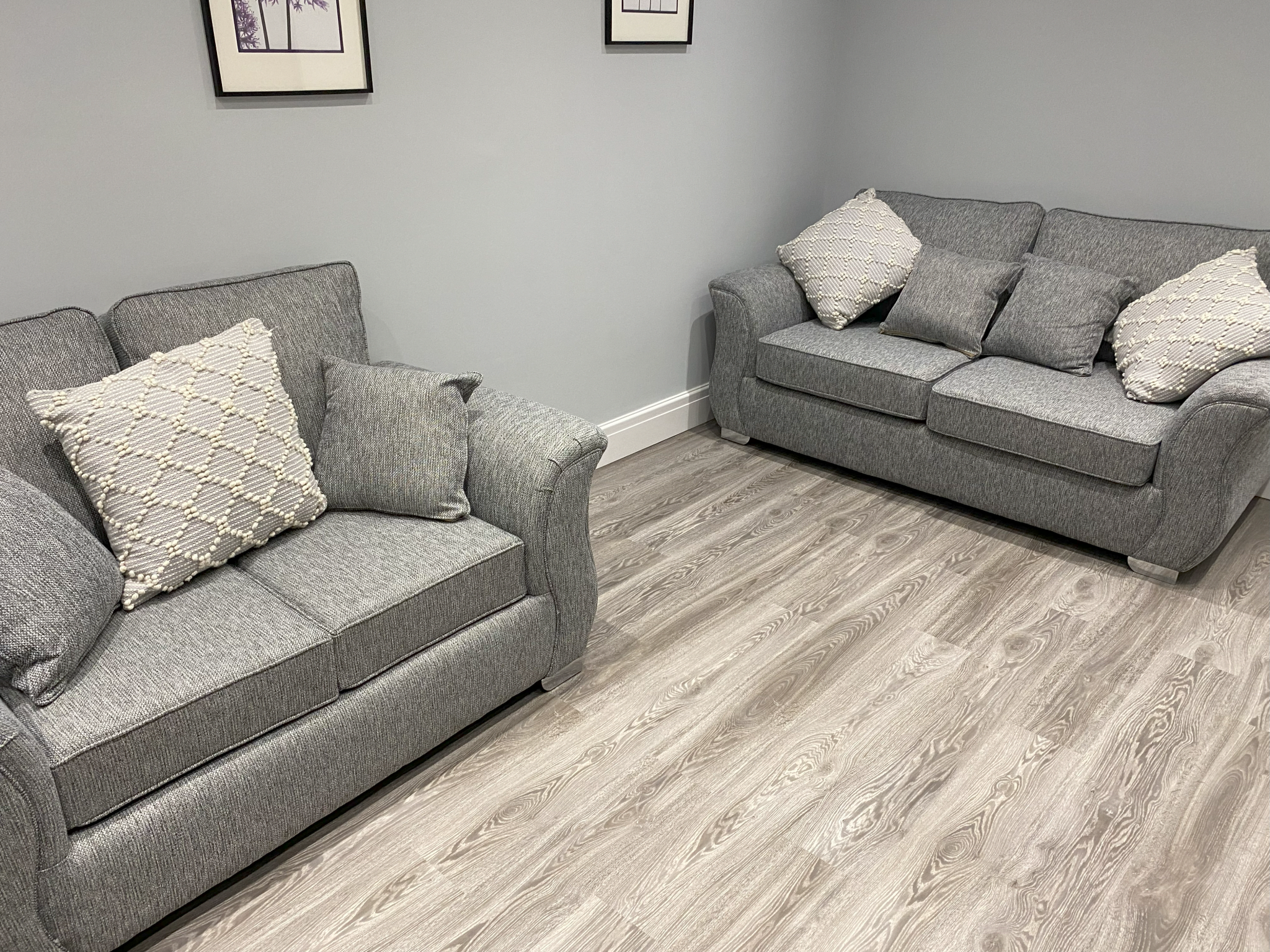 Grey sofas with patterned cushions